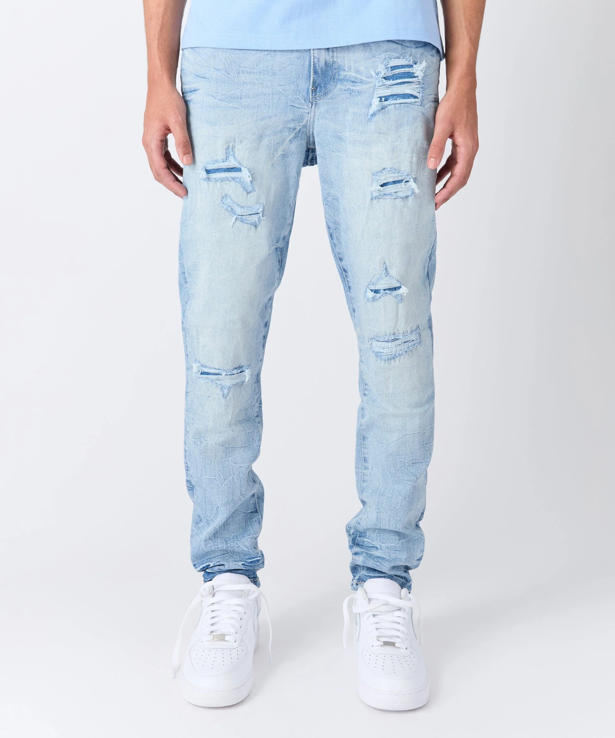 Rip And Repair Light Wash Denim Jeans