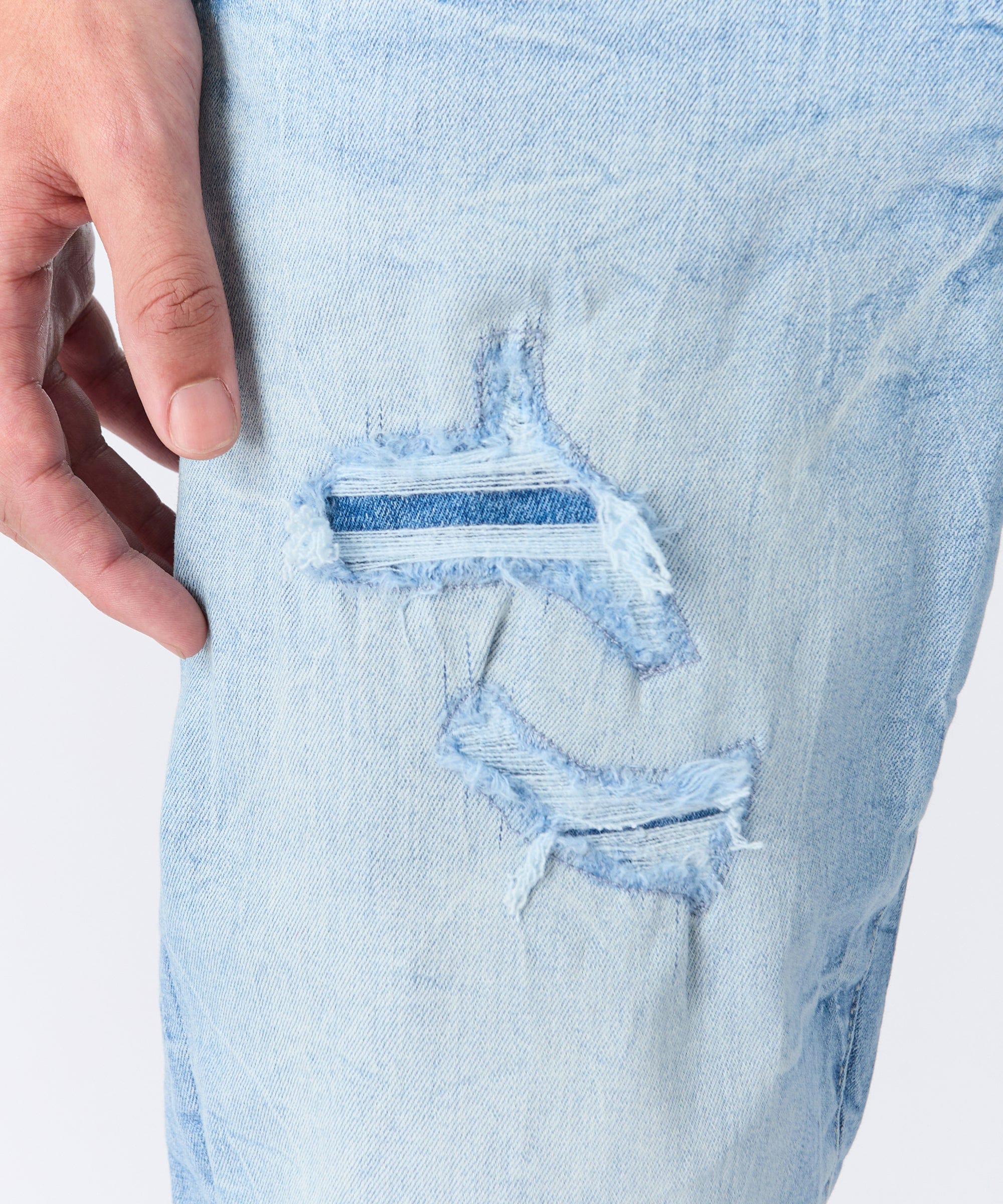 Rip And Repair Light Wash Denim Jeans - Image 2